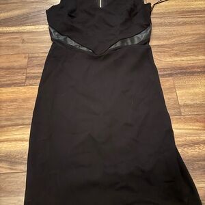 NWOT classy black dress.  Faux leather and mesh trimmings /detail. Size small